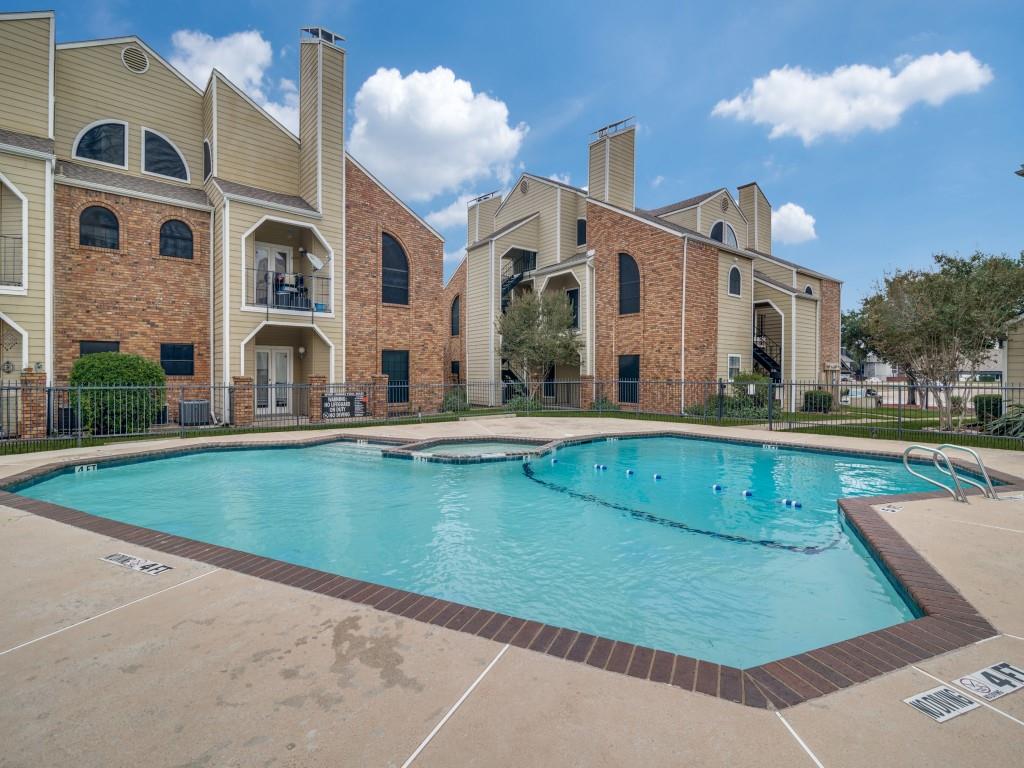 4434 Point Boulevard, Unit 208 Garland, TX 75043 - Photo 26 of 28 a view of a house with a swimming pool