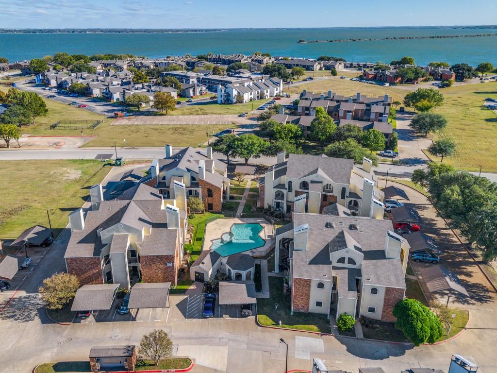 4434 Point Boulevard, Unit 208 Garland, TX 75043 - Photo 27 of 28 an aerial view of a building with outdoor space