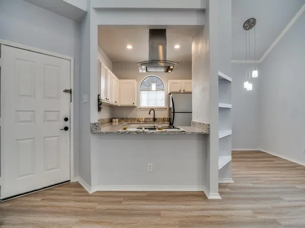 a view of a kitchen with a sink