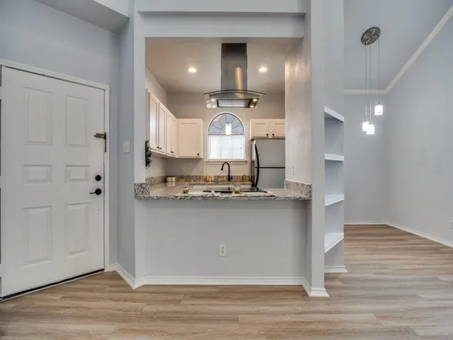 a view of a kitchen with a sink