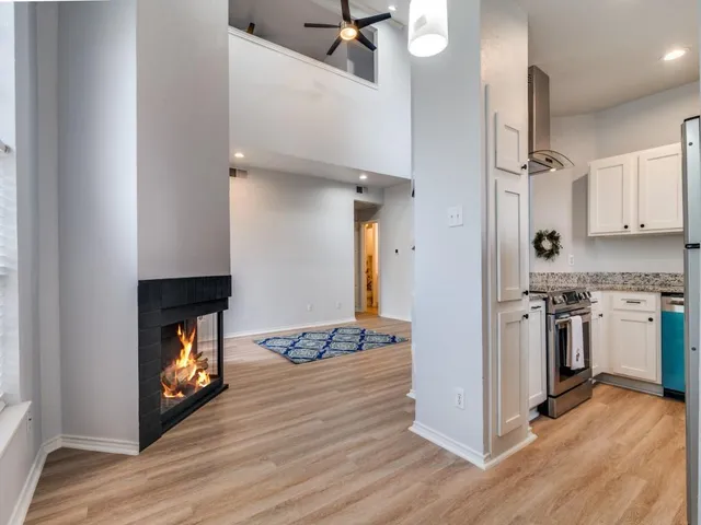a kitchen with a refrigerator and a stove