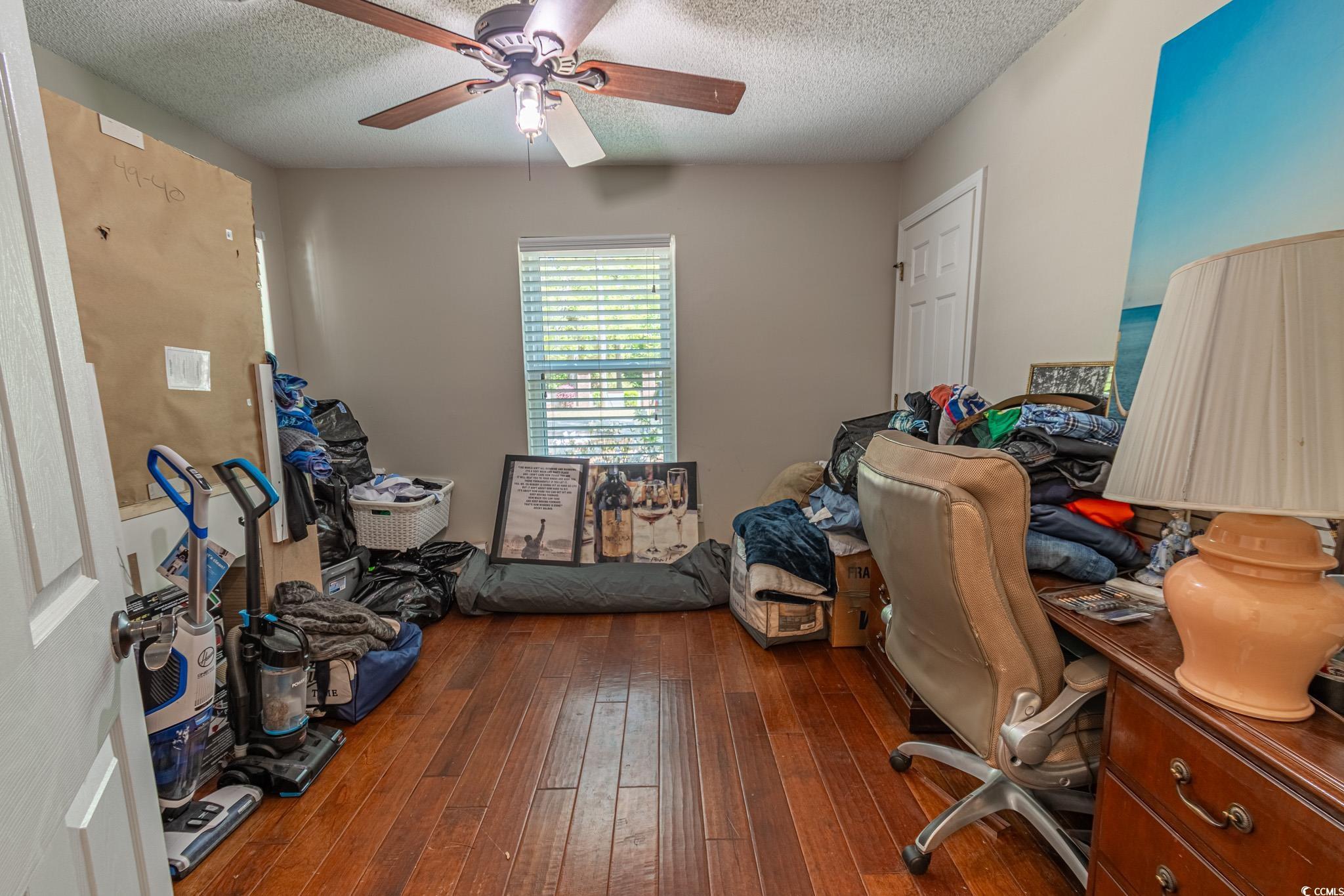675 Mariner Avenue Murrells Inlet, SC 29576 - Photo 13 of 27 Office area featuring dark wood-style flooring, ceiling fan, and a textured ceiling