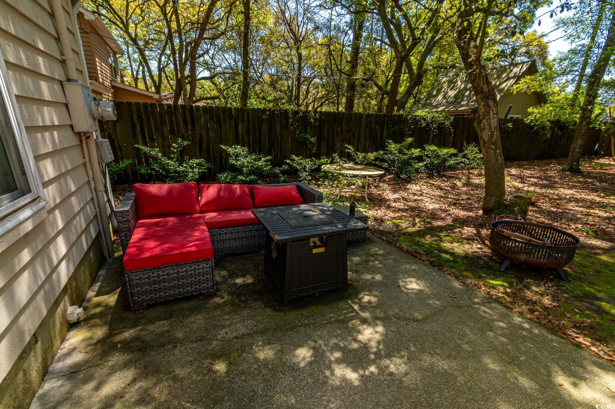 675 Mariner Avenue Murrells Inlet, SC 29576 - Photo 16 of 27 View of patio with a fenced backyard