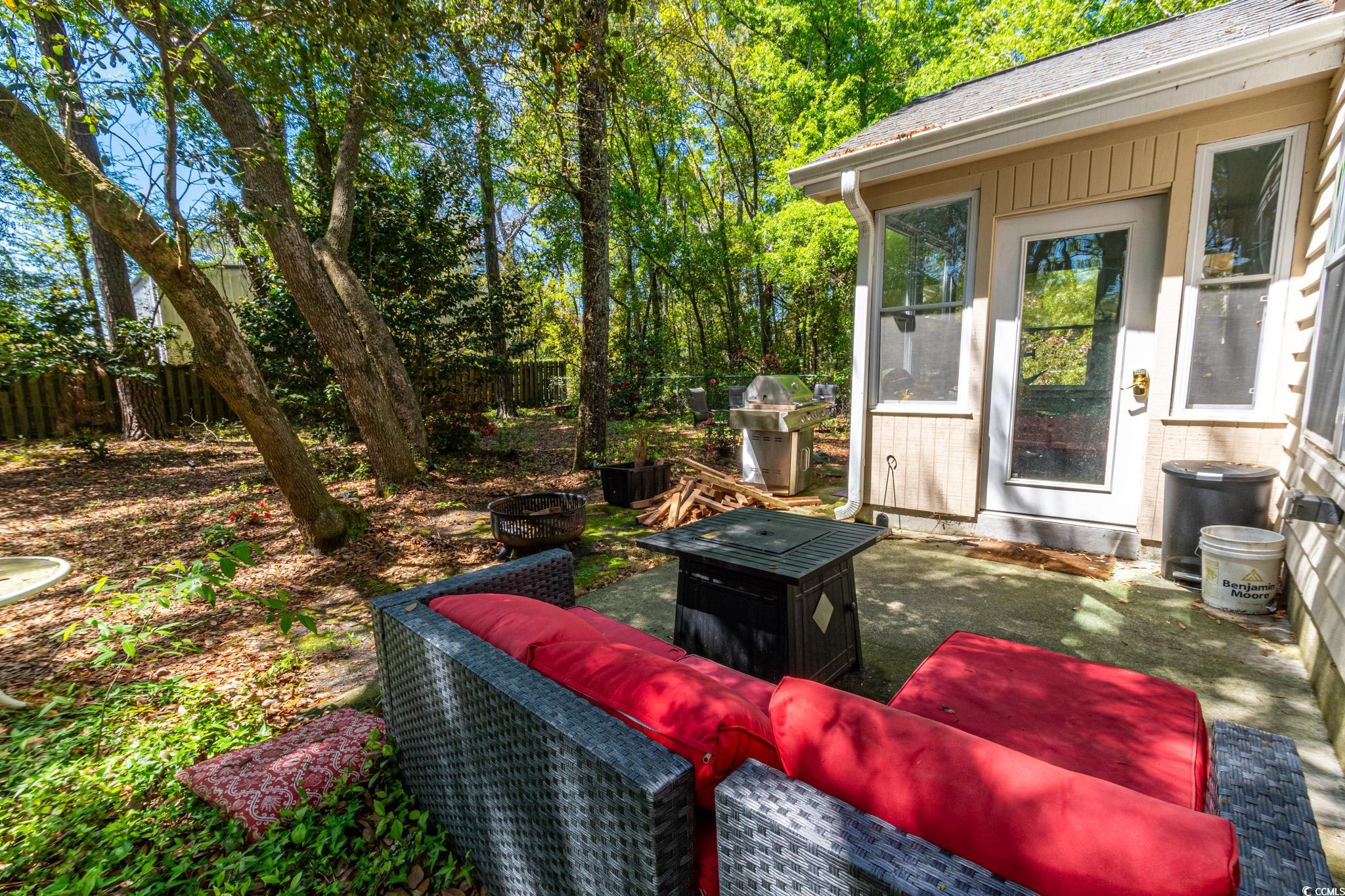 675 Mariner Avenue Murrells Inlet, SC 29576 - Photo 17 of 27 Exterior space with a fenced backyard and a patio area