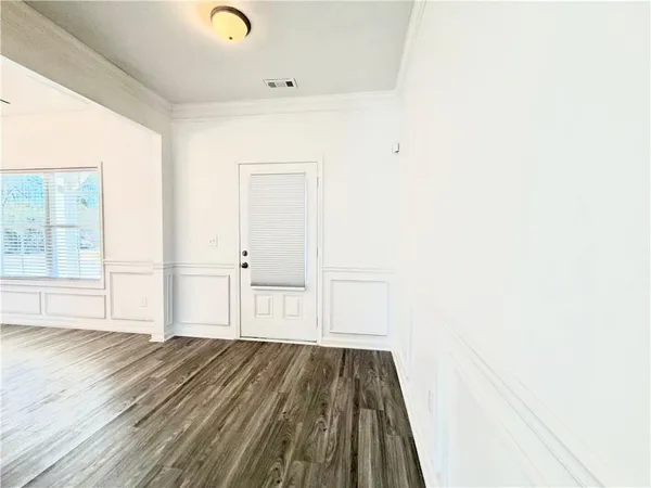 a view of a livingroom with wooden floor