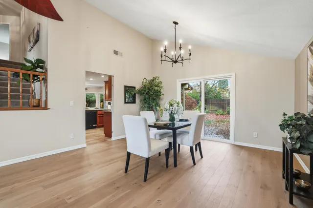 a spacious bedroom with a bed and a large window