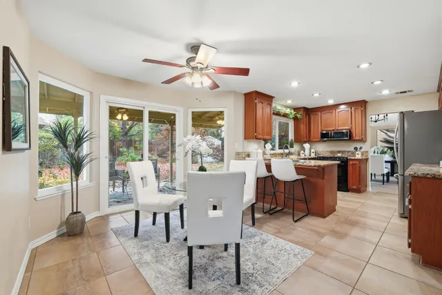 an empty room with a ceiling fan and a window