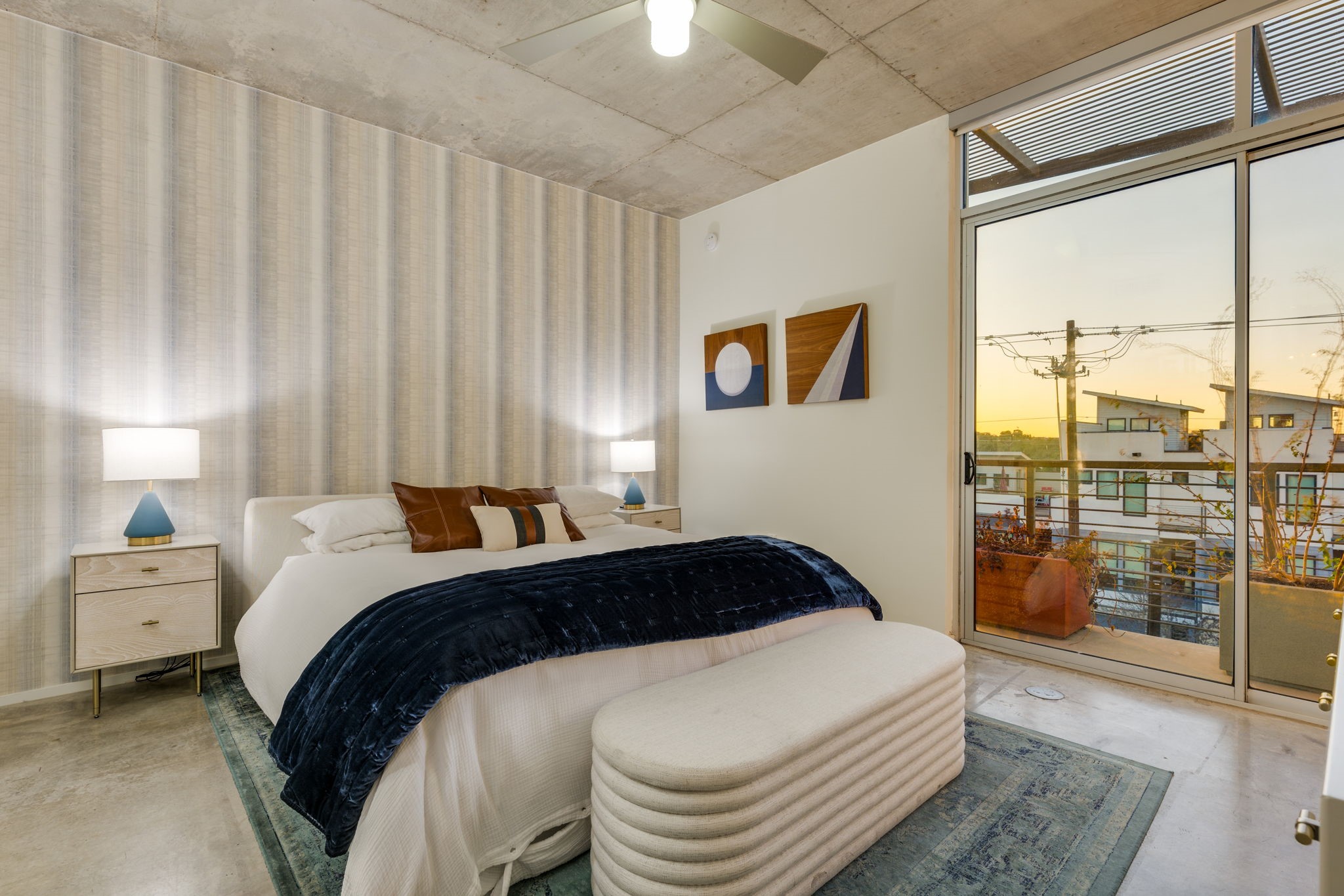 2301 South 5th Street, Unit 5 Austin, TX 78704 - Photo 25 of 39 Bedroom with ceiling fan, concrete floors, and access to outside
