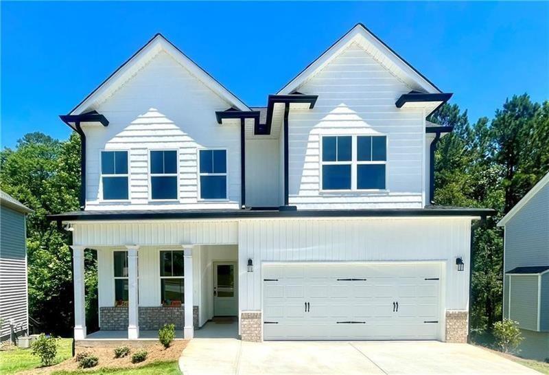 27 Bridgestone Way Cartersville, GA 30120 - Photo 1 of 31 a front view of a house with a yard