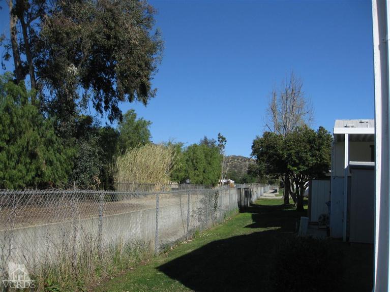 6480 Katherine Road, Unit 10 Simi Valley, CA 93063 - Photo 4 of 20 a view of a lake from a yard