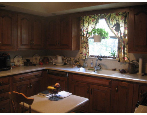 142 Center Road Shirley, MA 01464 - Photo 9 of 12 a kitchen with a sink a window and cabinets