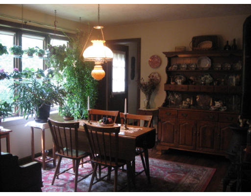 142 Center Road Shirley, MA 01464 - Photo 10 of 12 a view of a dining room with furniture and chandelier