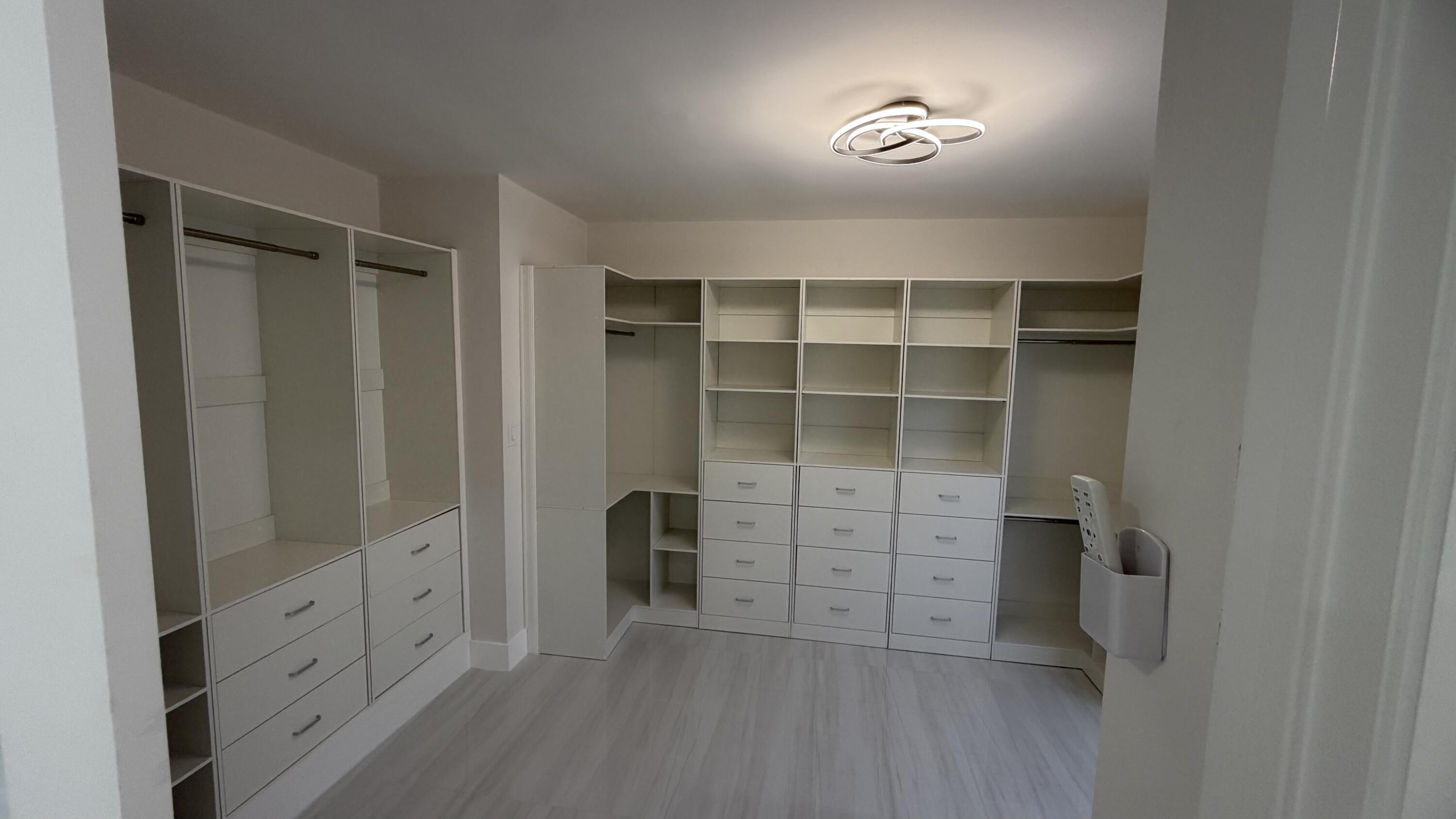 2521 Northeast 45th Street Lighthouse Point, FL 33064 - Photo 11 of 25 a view of walk in closet with empty racks