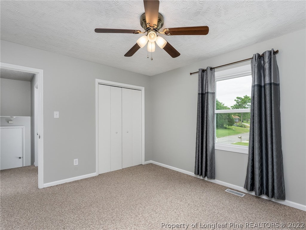 452 Saddle Ridge Road Fayetteville, NC 28311 - Photo 24 of 37 a view of a livingroom with a ceiling fan and window