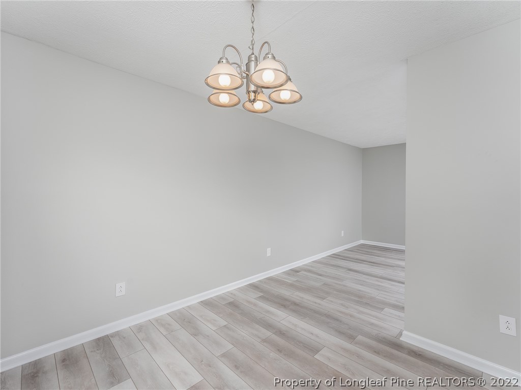 452 Saddle Ridge Road Fayetteville, NC 28311 - Photo 8 of 37 a view of room with window and wooden floor