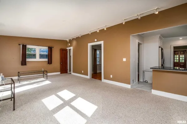 a view of a livingroom with a staircase