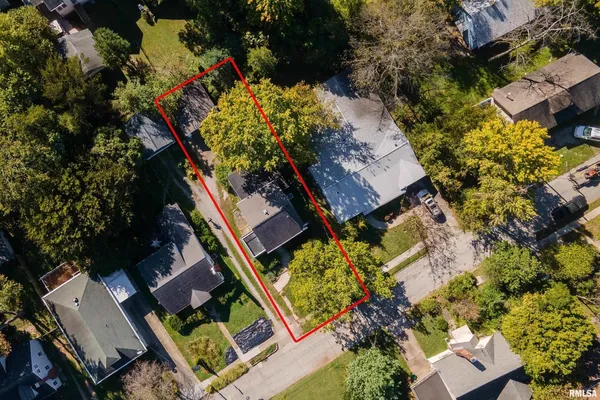 an aerial view of house with yard