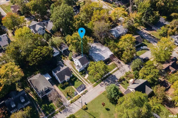an aerial view of a house with a garden
