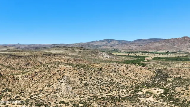 a view of mountain with an ocean