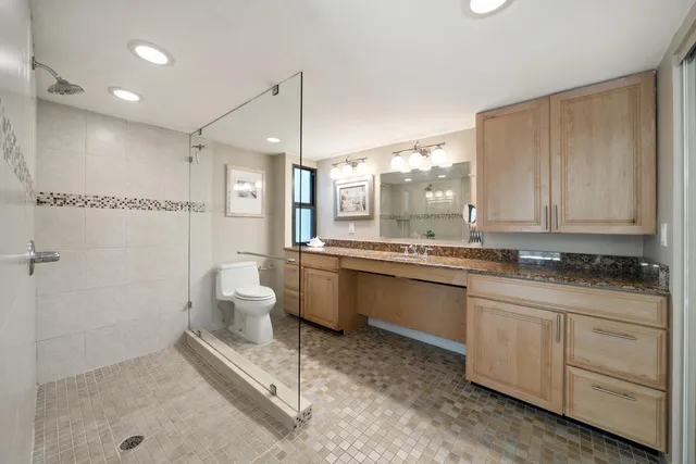 a bathroom with a tub and shower