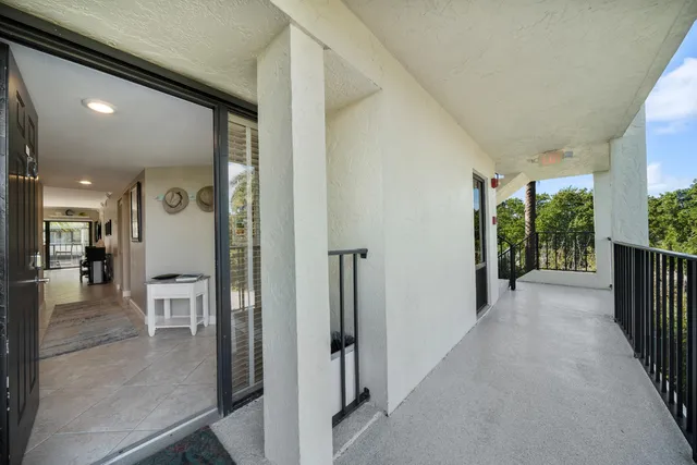 a bathroom with a shower and a glass door