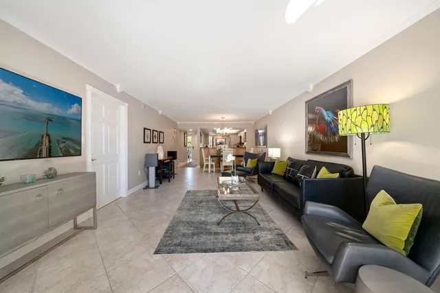 a view of a porch and dining room with furniture