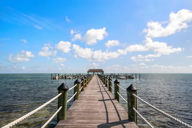 a view of a balcony with wooden floor and city view