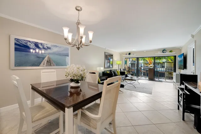 a kitchen with stainless steel appliances granite countertop a stove a sink dishwasher and a refrigerator