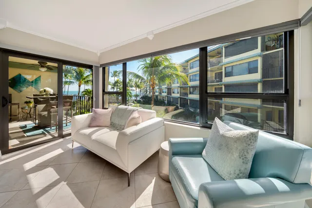 a bed room with a bed a flat screen tv and a couch