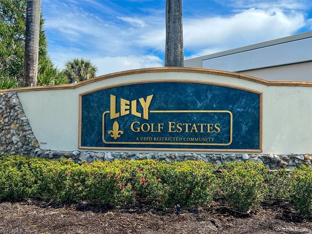 75 St Andrews Boulevard, Unit C301 Naples, FL 34113 - Photo 37 of 41 a sign on the side of a building