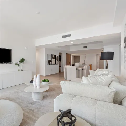 a bedroom with a bed and a night stand