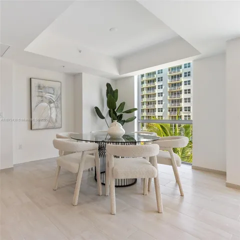a bathroom with a double vanity sink toilet and shower