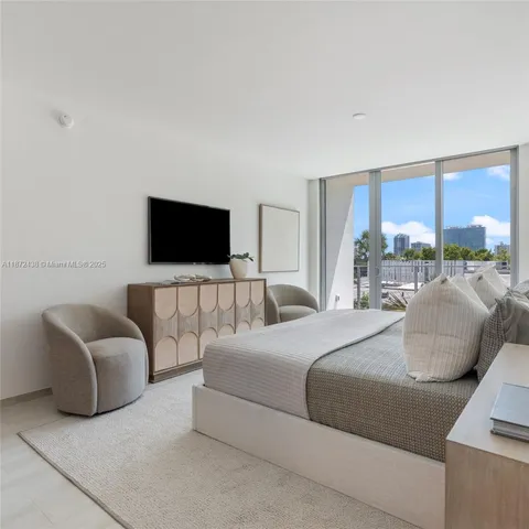 a view of a swimming pool with lawn chairs and a fire pit