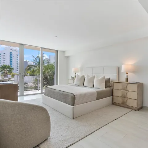 a view of a chairs and table in patio with a fire pit