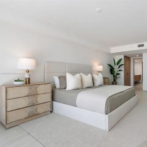 a swimming pool with an outdoor space and seating area