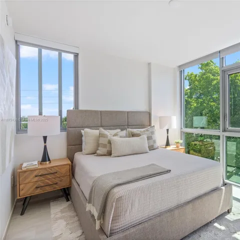a view of a patio with table and chairs and potted plants
