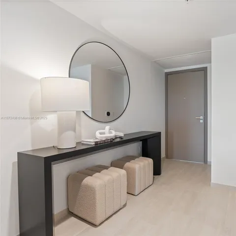 a kitchen with kitchen island a sink a stove and a refrigerator