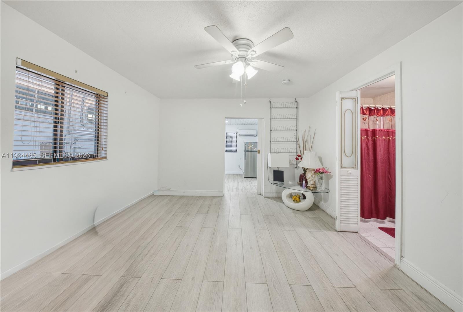 3640 Southwest 92nd Avenue Miami, FL 33165 - Photo 15 of 30 a view of a storage & utility room with wooden floor