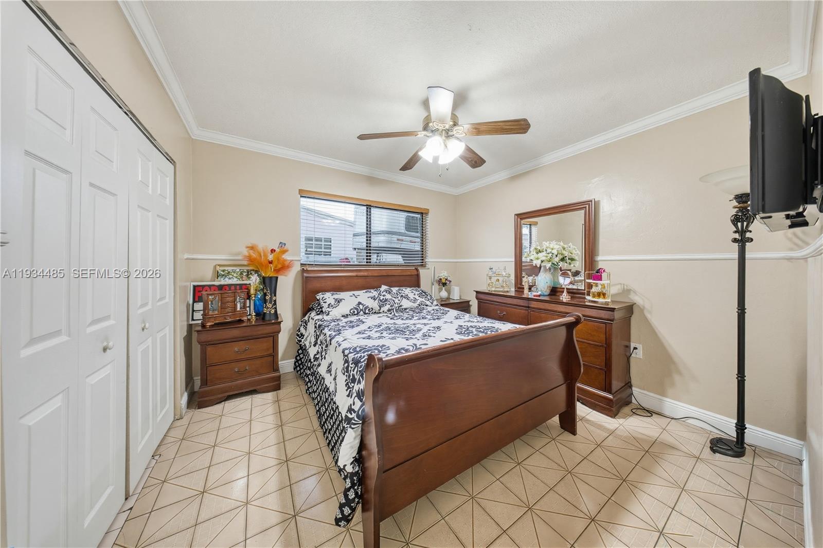 3640 Southwest 92nd Avenue Miami, FL 33165 - Photo 21 of 30 a bedroom with a bed and a flat screen tv