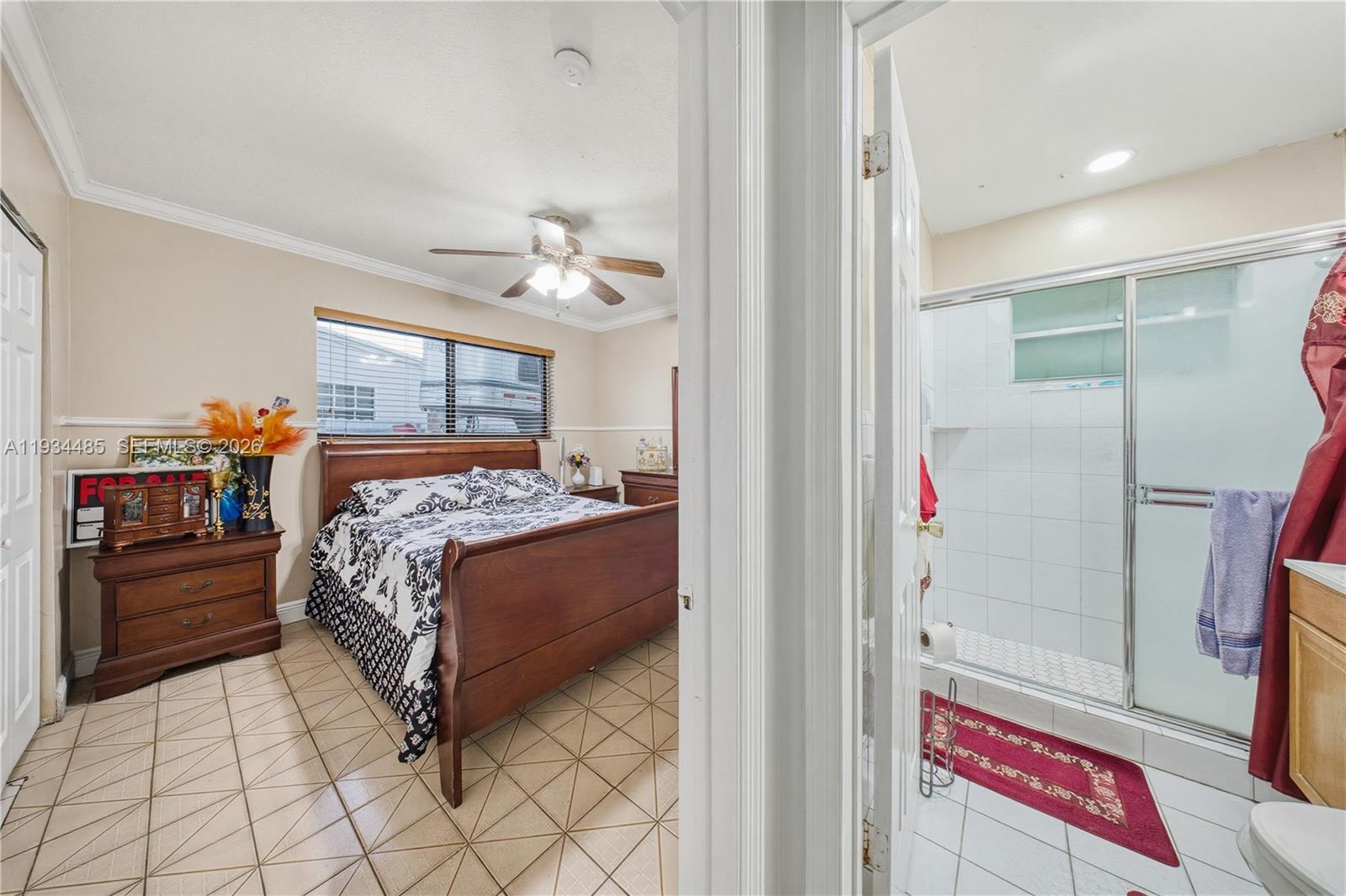 3640 Southwest 92nd Avenue Miami, FL 33165 - Photo 22 of 30 a bedroom with a bed and a chandelier