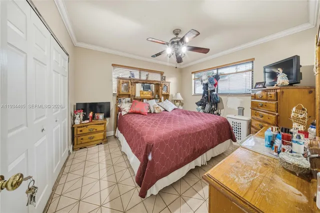 a bed room with a bed and a television