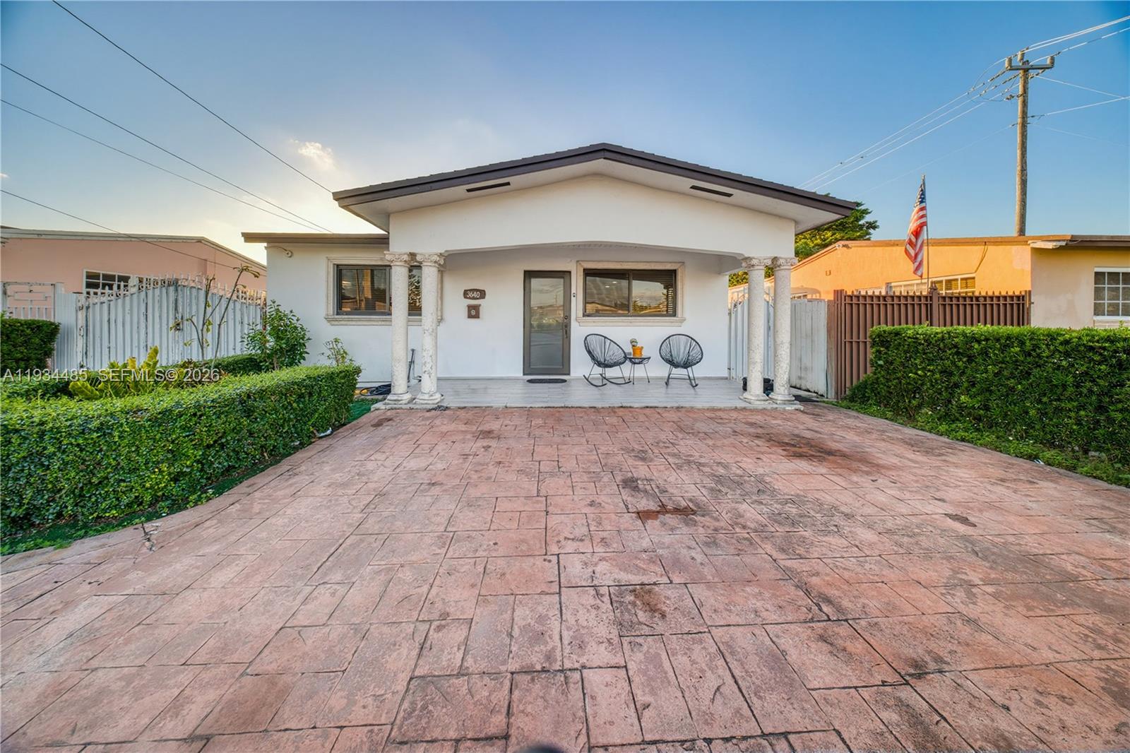 3640 Southwest 92nd Avenue Miami, FL 33165 - Photo 4 of 30 a front view of a house with a yard and garage