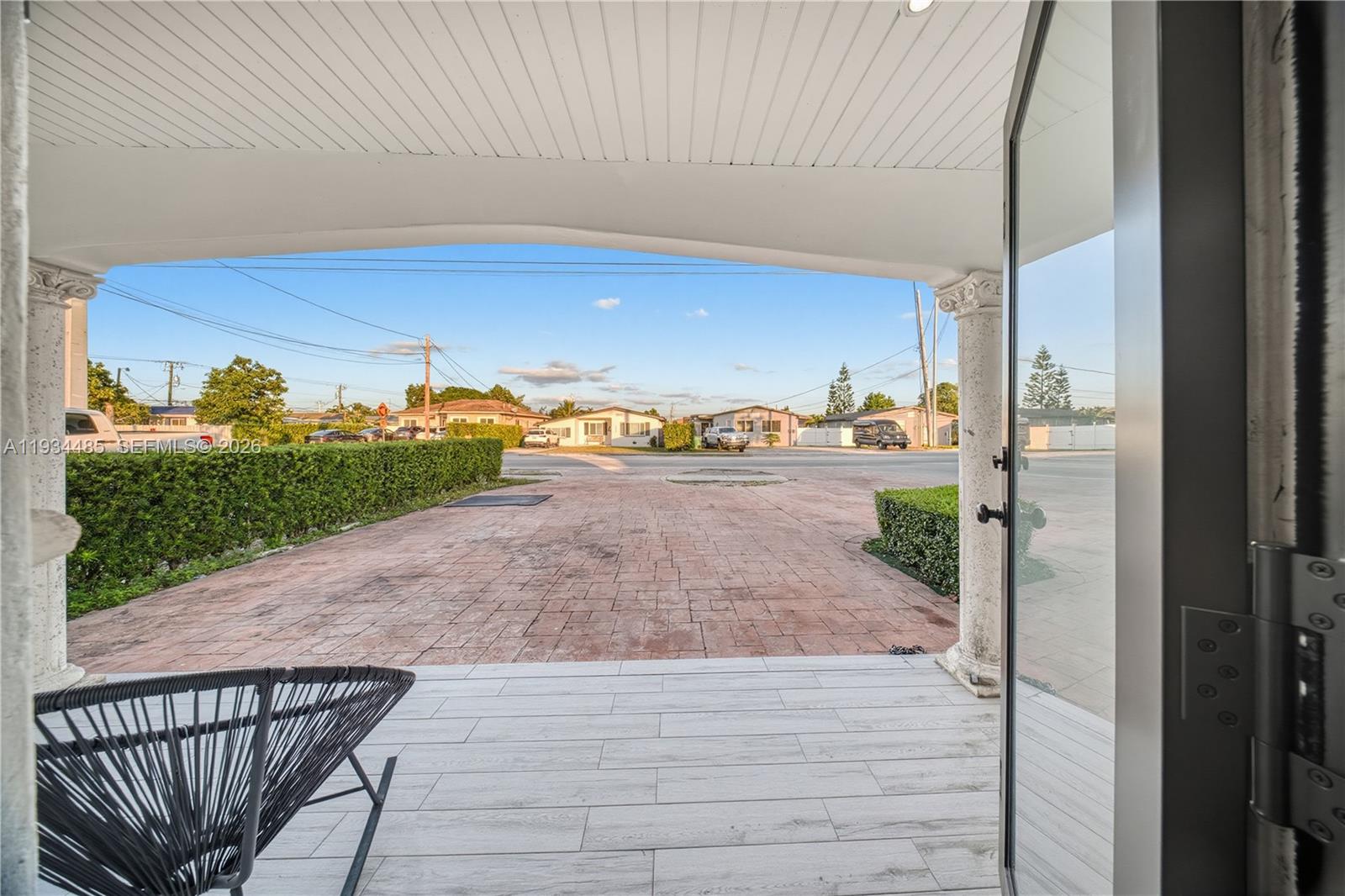 3640 Southwest 92nd Avenue Miami, FL 33165 - Photo 6 of 30 a view of a balcony with floor to ceiling window and wooden floor