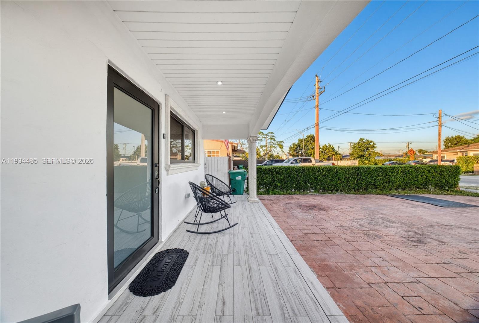 3640 Southwest 92nd Avenue Miami, FL 33165 - Photo 7 of 30 a view of a porch with furniture and floor to ceiling window