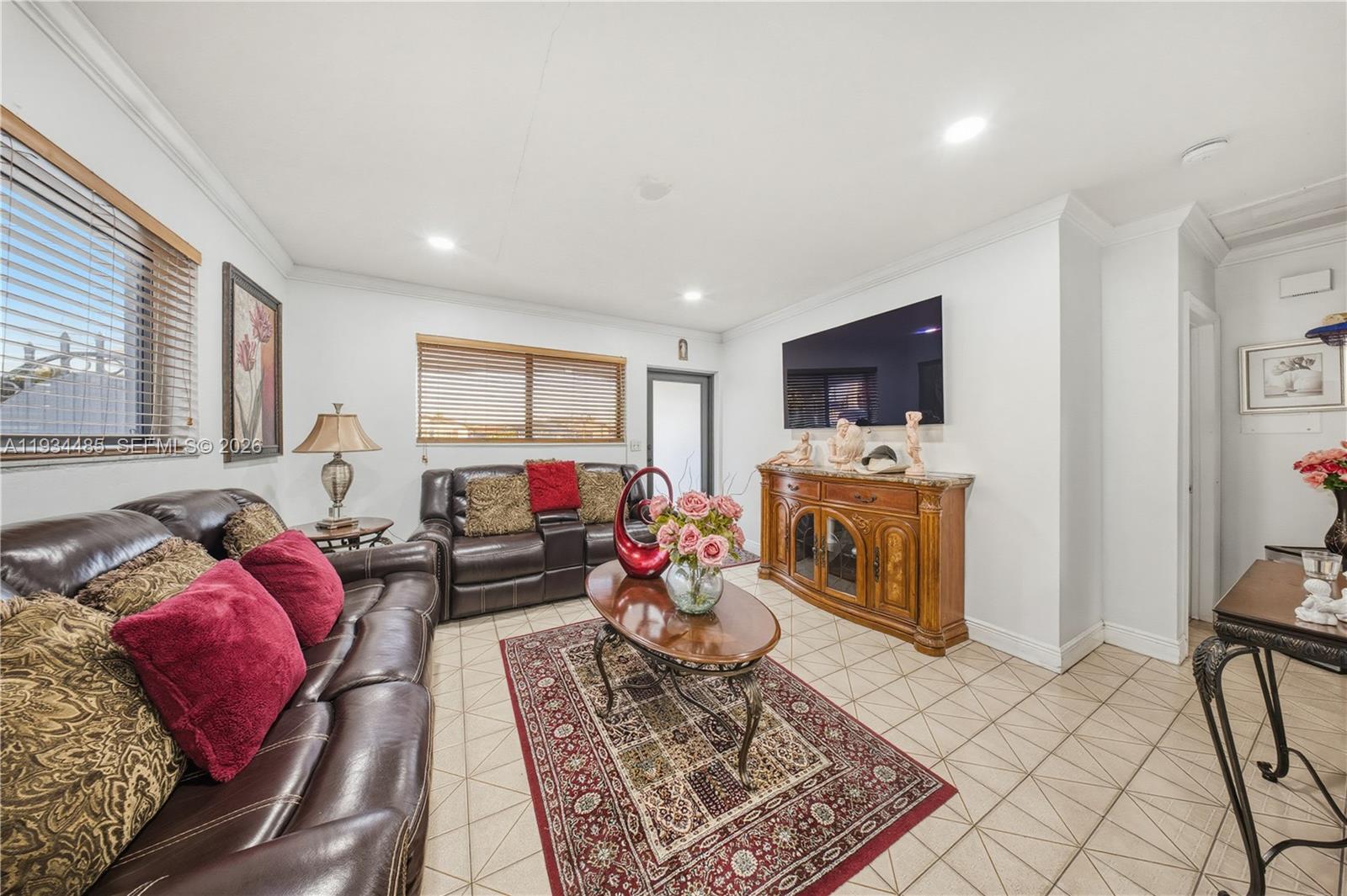3640 Southwest 92nd Avenue Miami, FL 33165 - Photo 9 of 30 a living room with furniture a fireplace and a flat screen tv