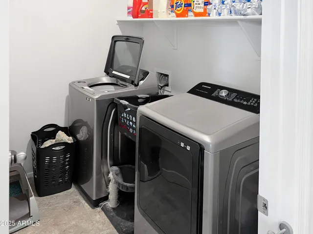 a utility room with dryer and washer