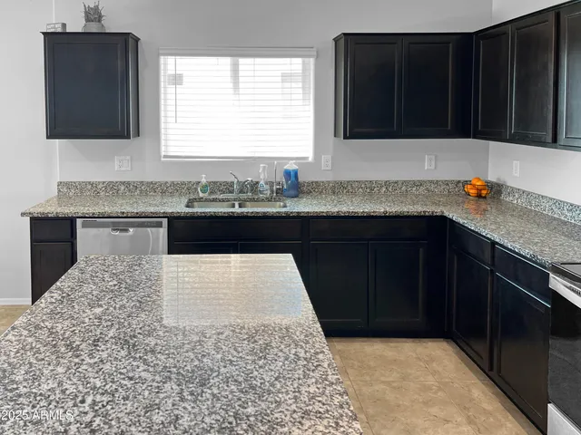 a kitchen with a sink and a cabinets