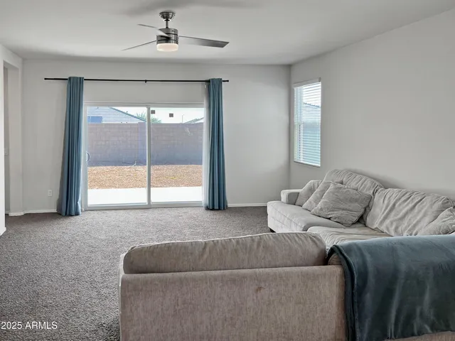 a living room with a couch and a large window