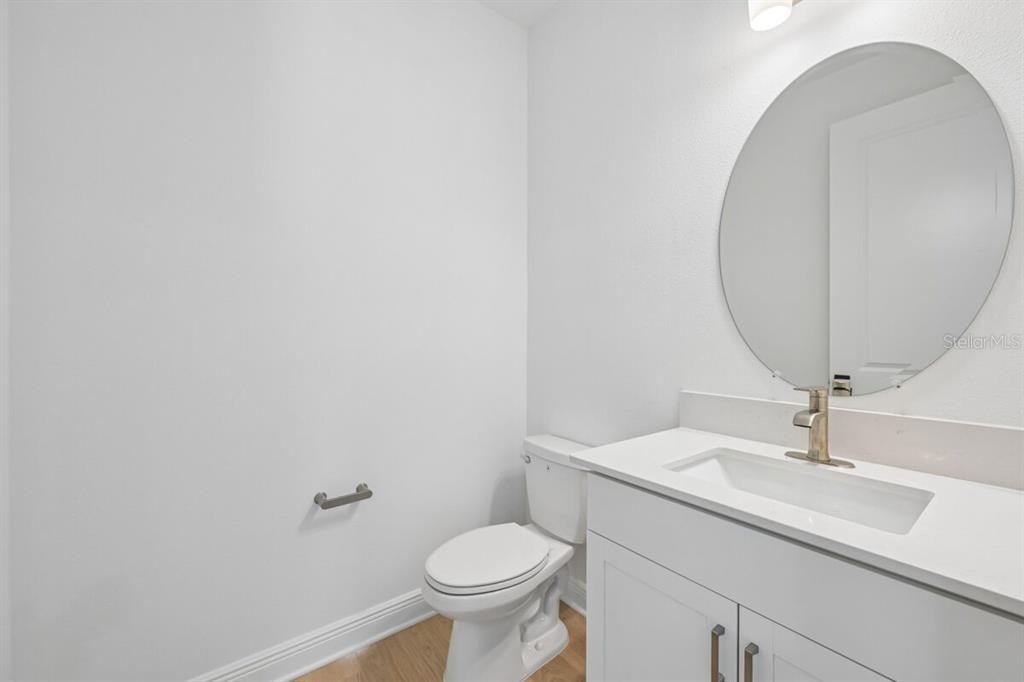 17712 Broadleaf Loop Venice, FL 34293 - Photo 16 of 23 a bathroom with a sink and a mirror