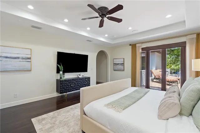 a bathroom with a granite countertop sink a toilet and a mirror